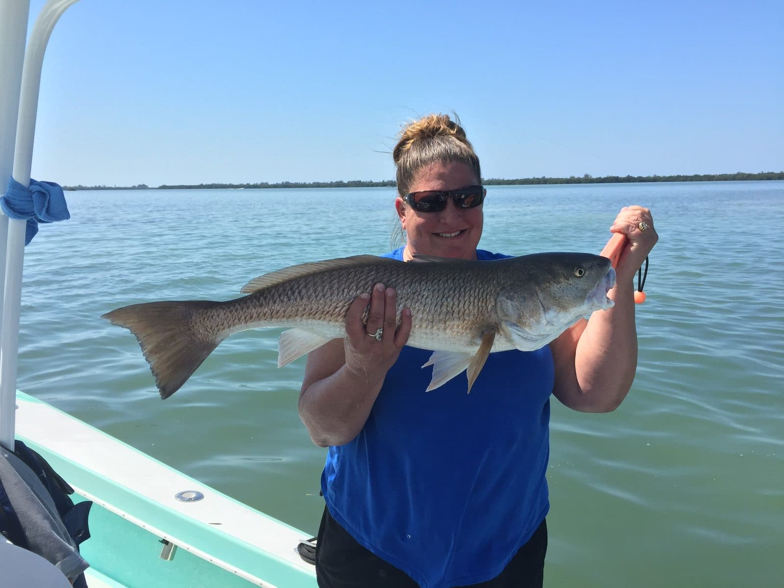 Angler holding a redfish