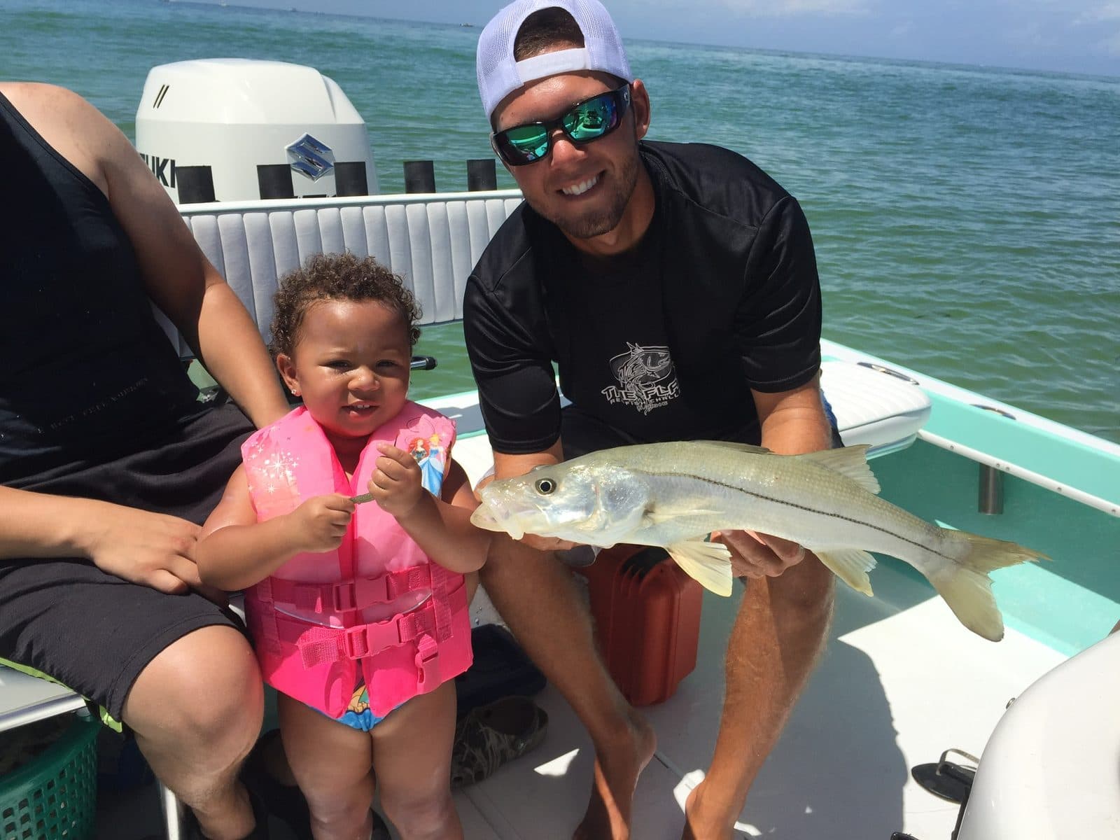 Toddler and dad with a snook