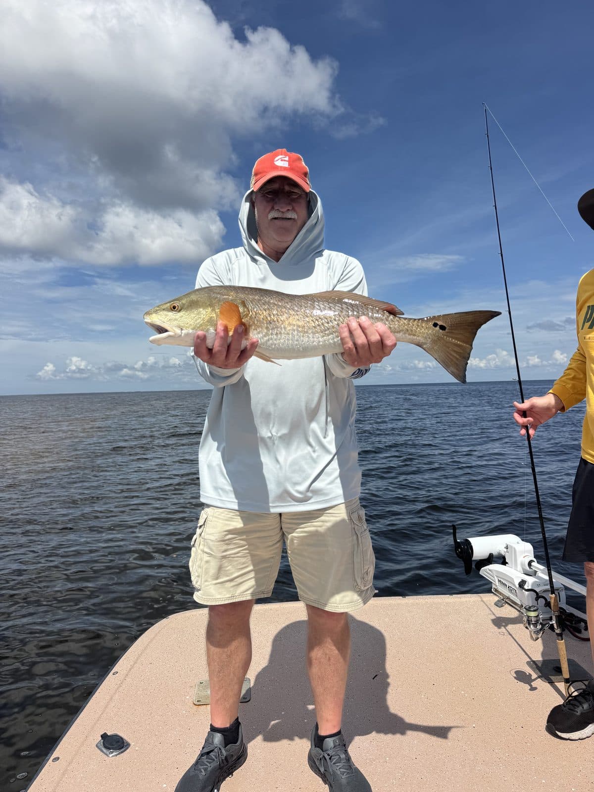 Angler holding a redfish