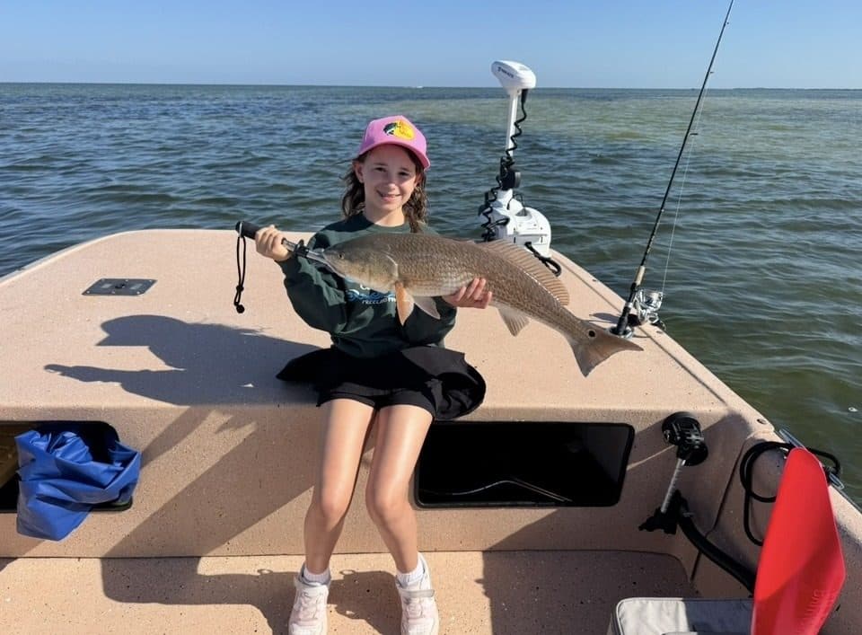 Young angler with a redfish