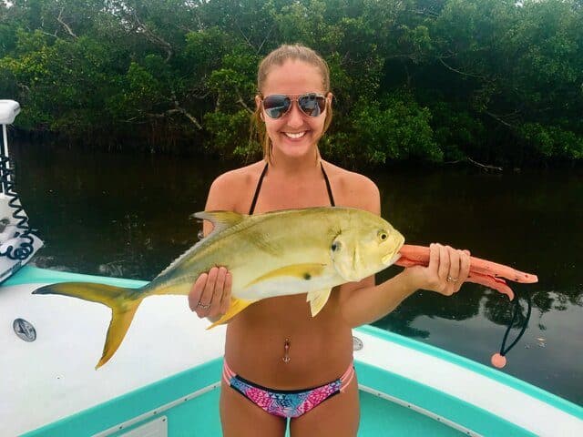 Angler holding a jack crevalle